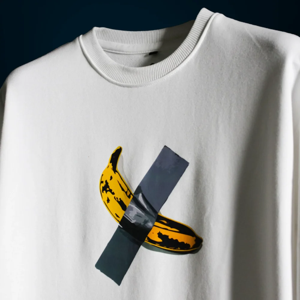 Detailed view of the high-density duct-taped banana graphic on the $6 Million Banana T-Shirt, showcasing the texture and print quality.